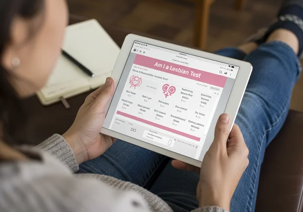 Person engaging with an online sexuality quiz on a tablet